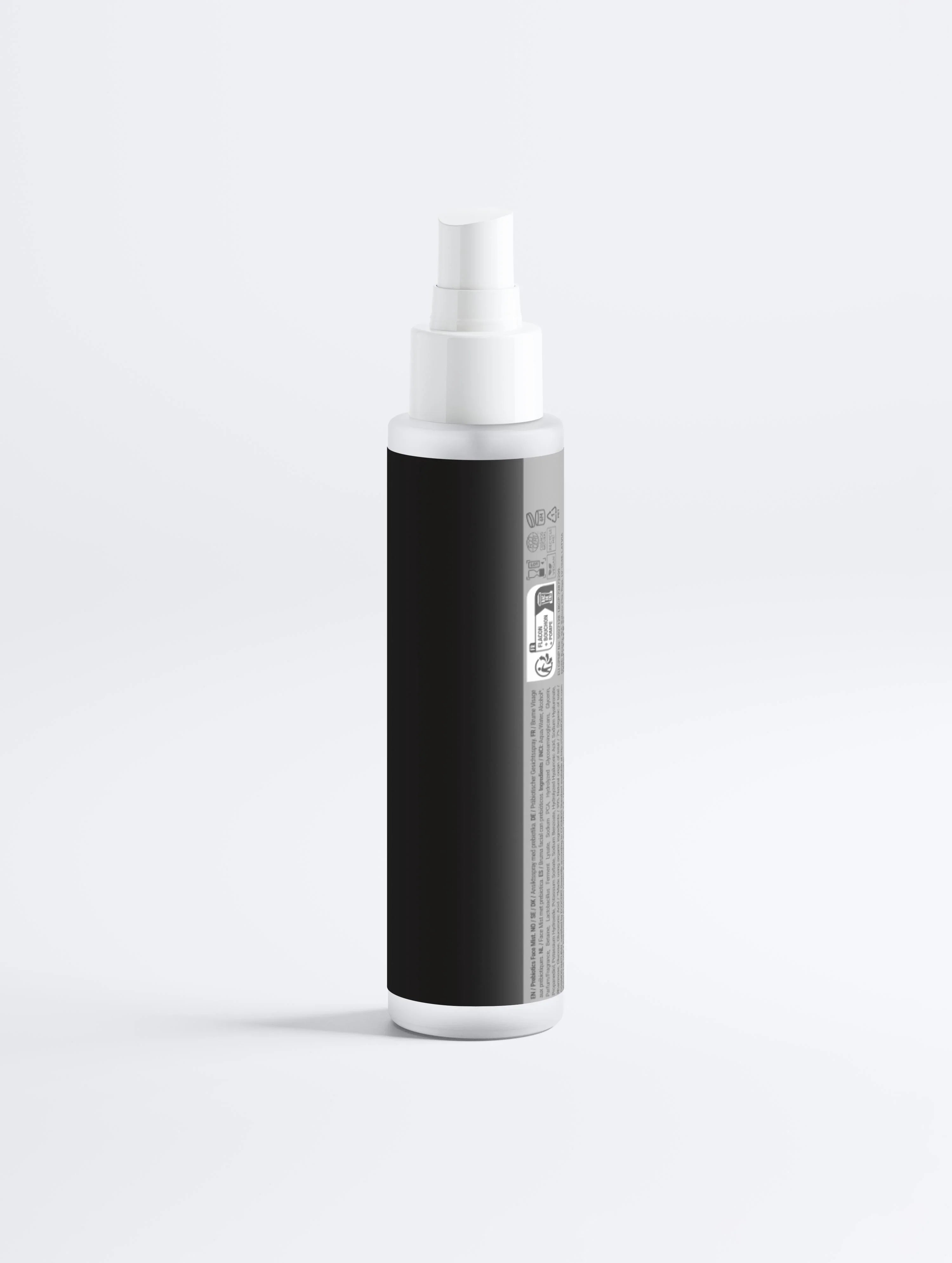 Black and white facial mist spray bottle with pump dispenser, minimalist design for skincare routine