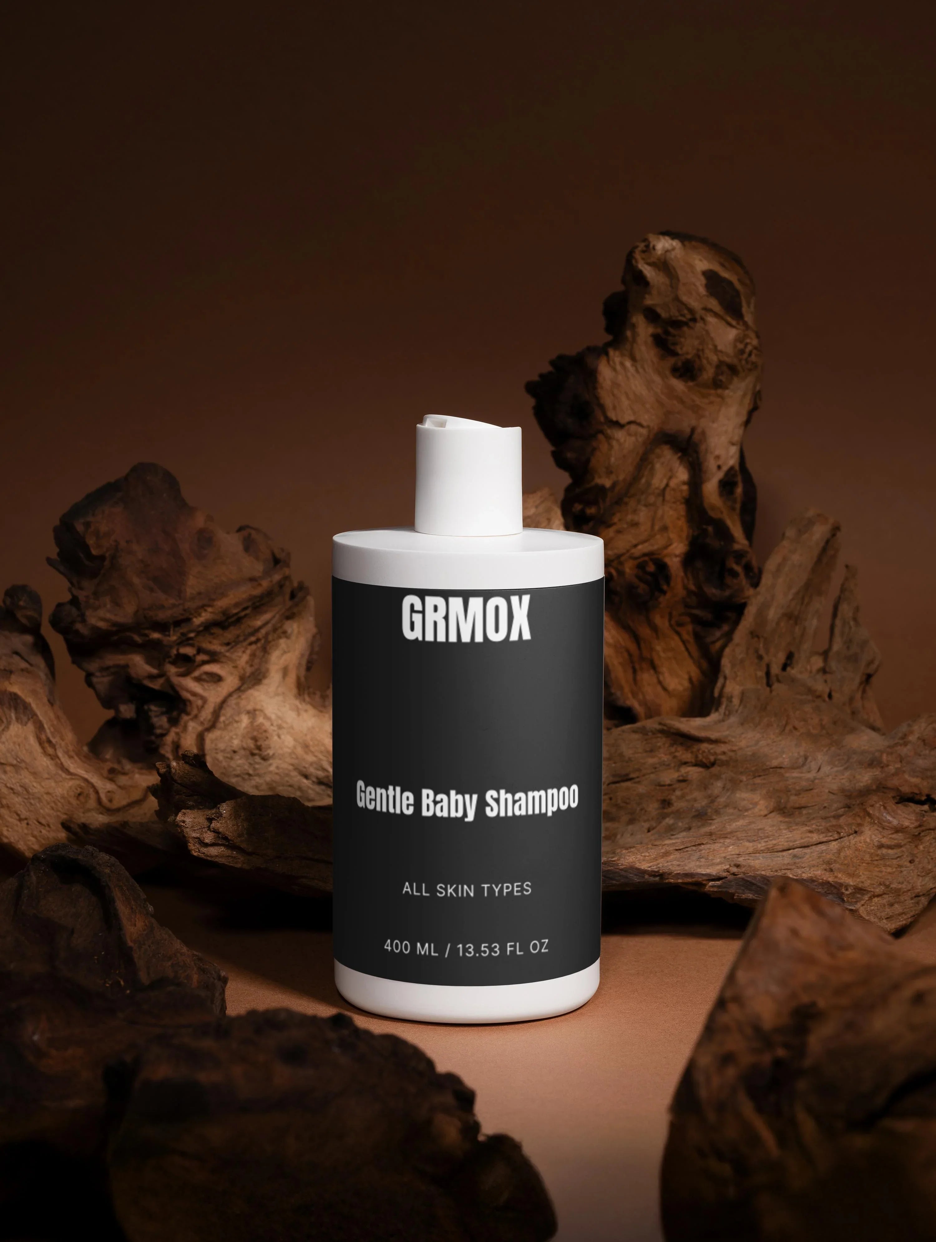 Gentle baby shampoo for all skin types, 400ml bottle with minimalist design on rustic wood background