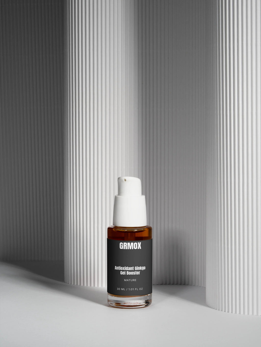 GRMOX Antioxidant Ginkgo Gel Booster in amber bottle with white pump, minimalist gray background