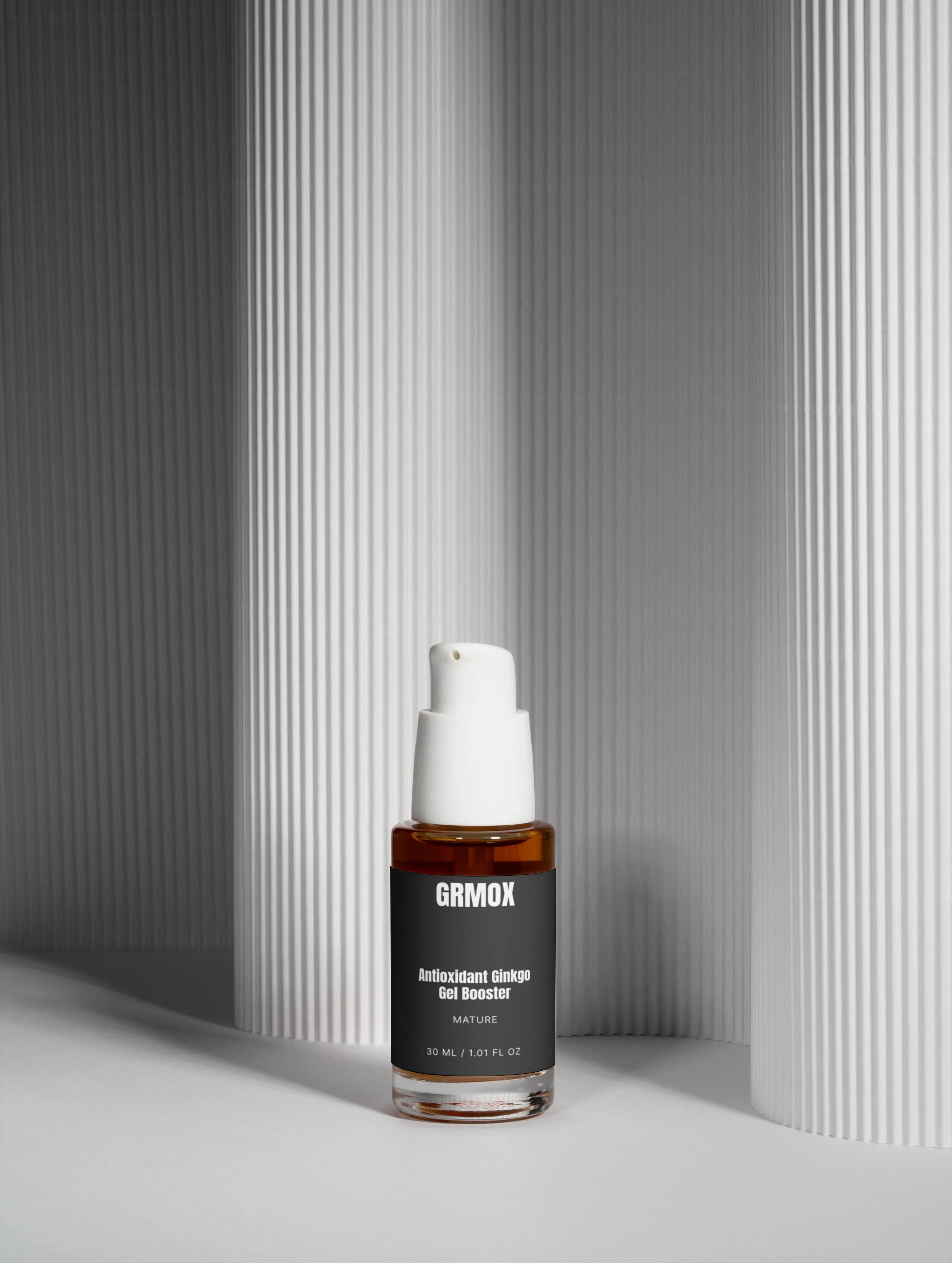GRMOX Antioxidant Ginkgo Gel Booster in amber bottle with white pump, minimalist gray background