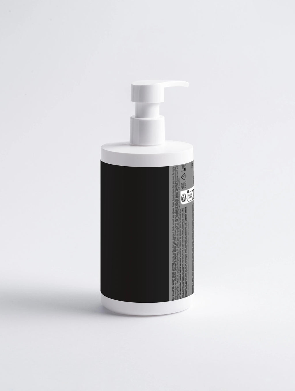 White pump bottle with black label, featuring Smoky Green Vetiver shampoo text on side