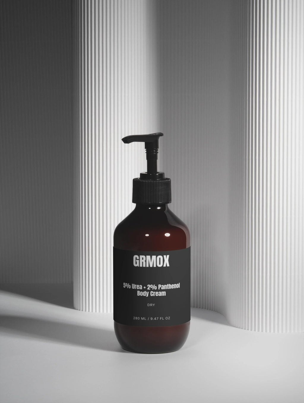 GRMOX 5% Urea + 2% Panthenol Body Cream for dry skin, 280ml pump bottle on textured white background