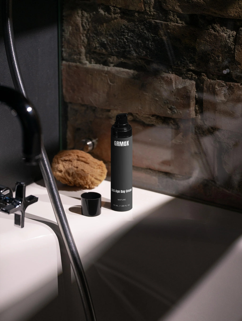 GRMOX Anti-Age Day Cream for mature skin, 50ml, on bathroom counter with stone wall backdrop