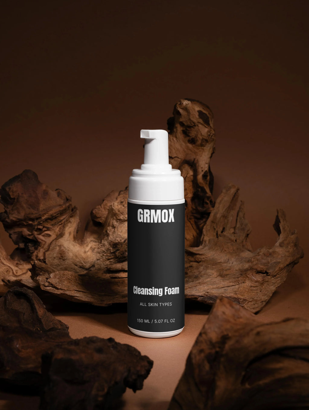 GRMOX Cleansing Foam for all skin types, 150ml bottle with pump, displayed on rustic wood background