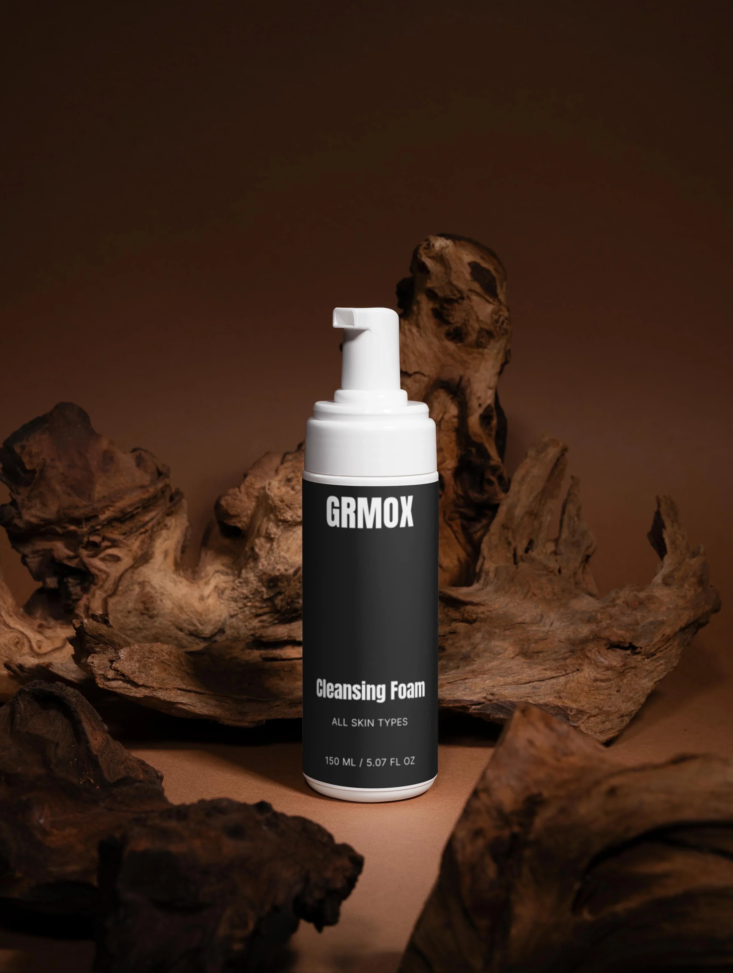 GRMOX Cleansing Foam for all skin types, 150ml bottle with pump, displayed on rustic wood background