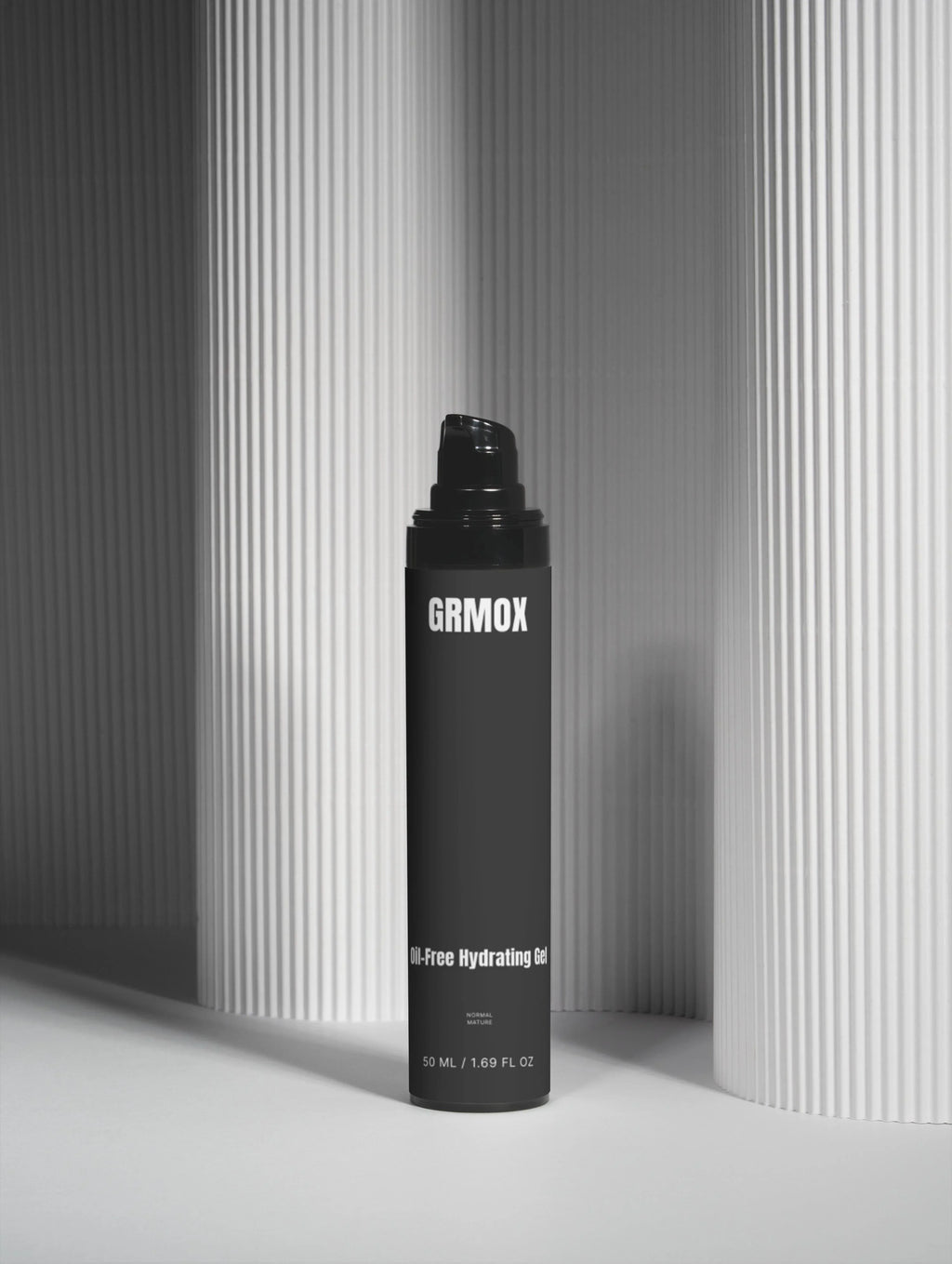 GRMOX Oil-Free Hydrating Gel for normal to mature skin, 50ml black bottle against striped backdrop