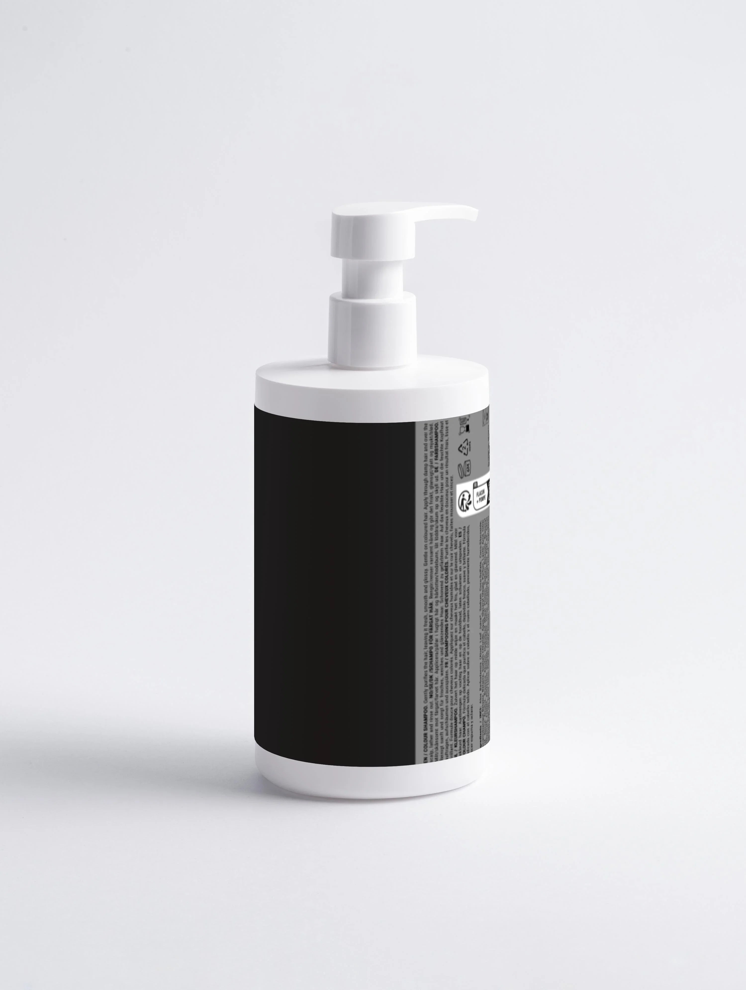 White pump bottle with black label, featuring multilingual text and usage icons for hair care product
