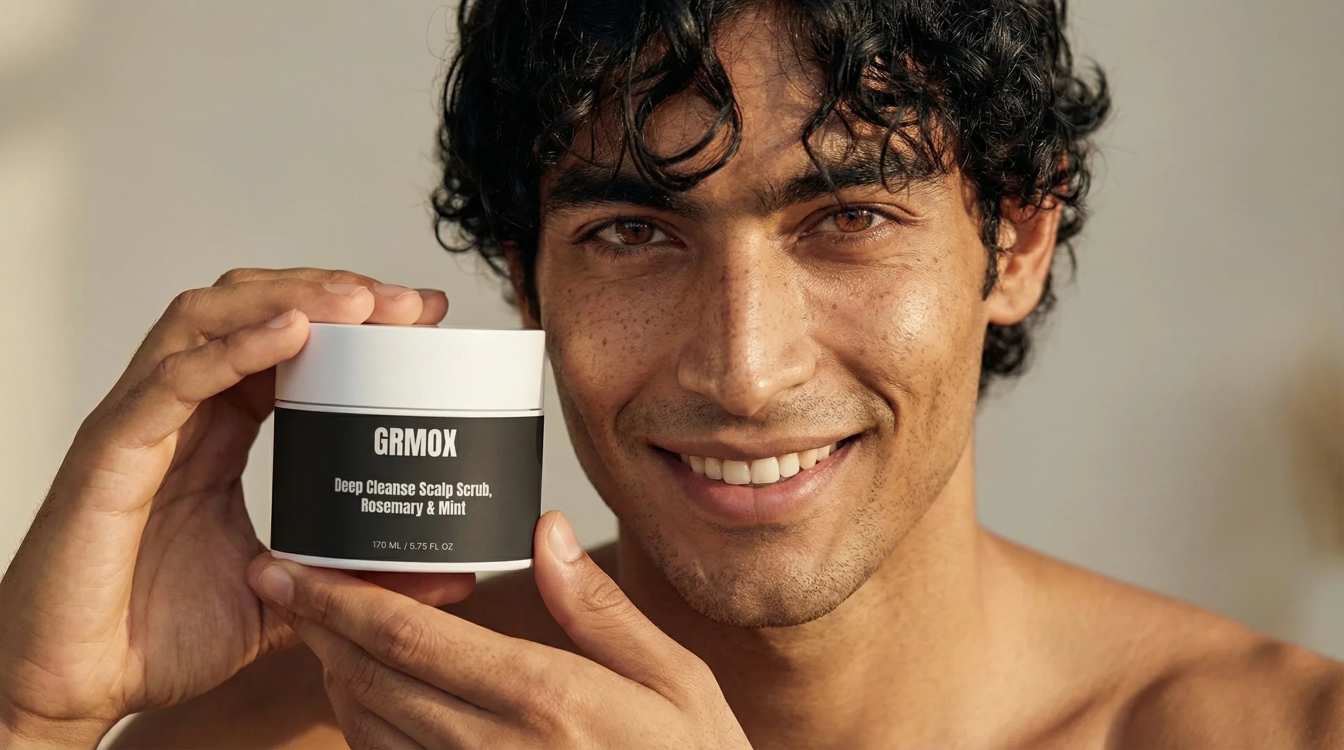 Man holding GRMOX Deep Cleanse Scalp Scrub with Rosemary & Mint, 170ml, for healthy scalp care
