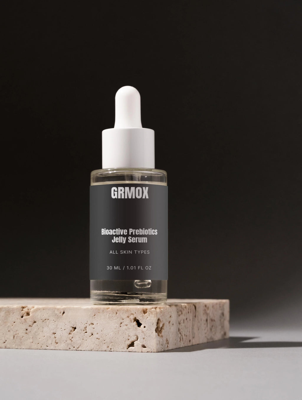 GRMOX Bioactive Prebiotics Jelly Serum for all skin types, 30ml glass dropper bottle on stone base