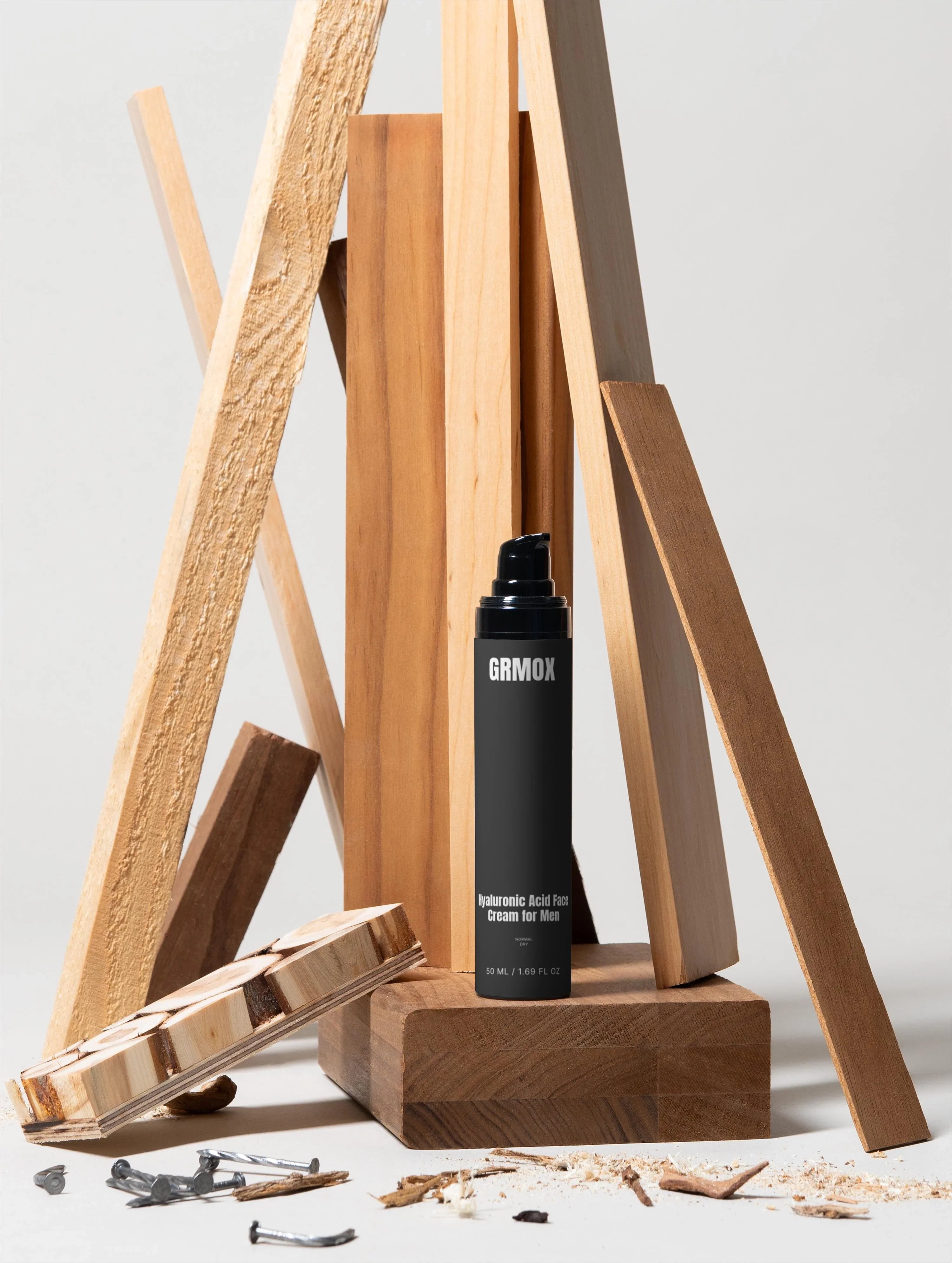 GRMOX Hyaluronic Acid Face Cream for Men, 50ml, displayed with rustic wood pieces and nails on white background