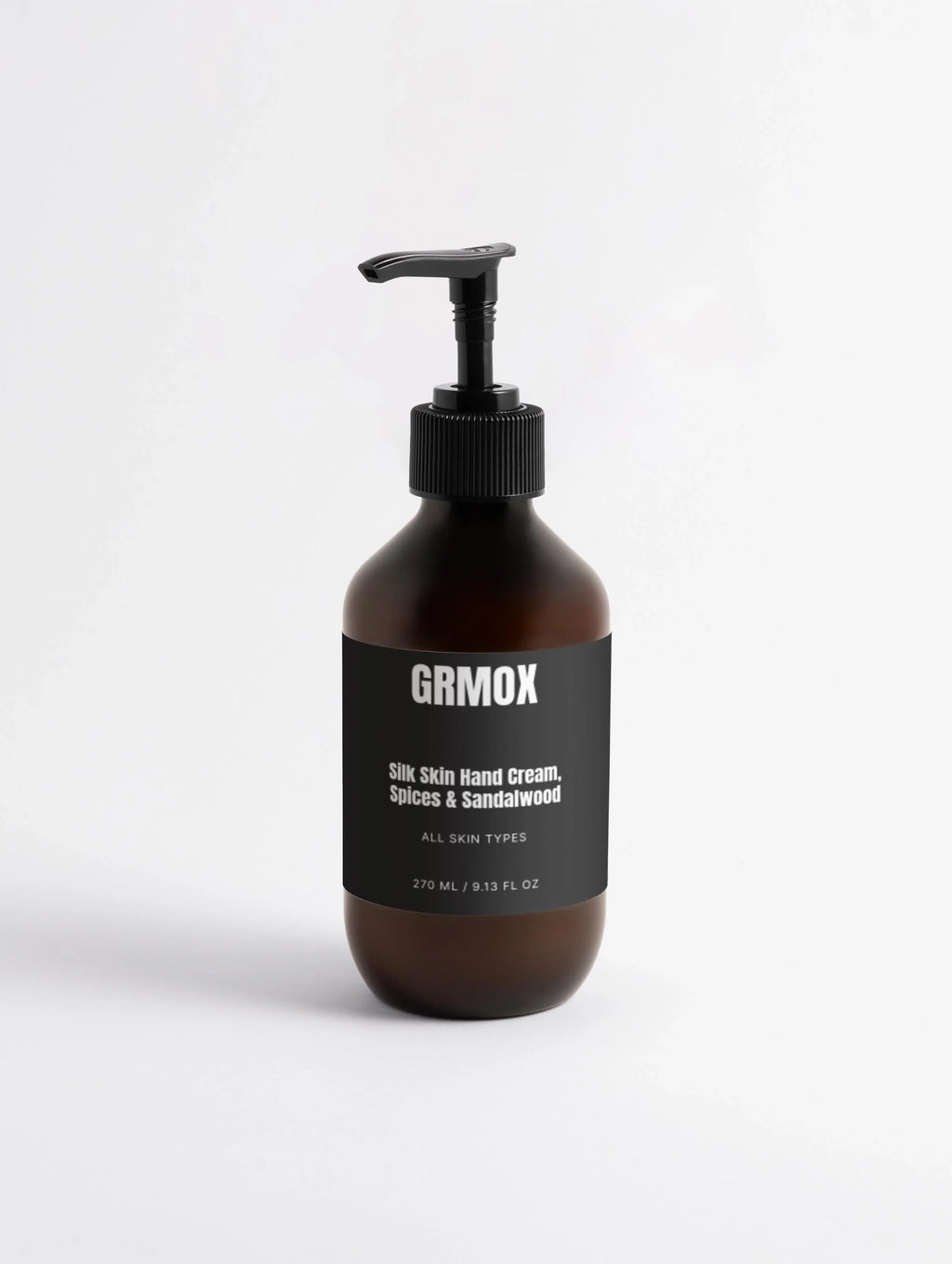 Silk Skin Hand Cream in amber bottle with black pump, Spices & Sandalwood scent for all skin types