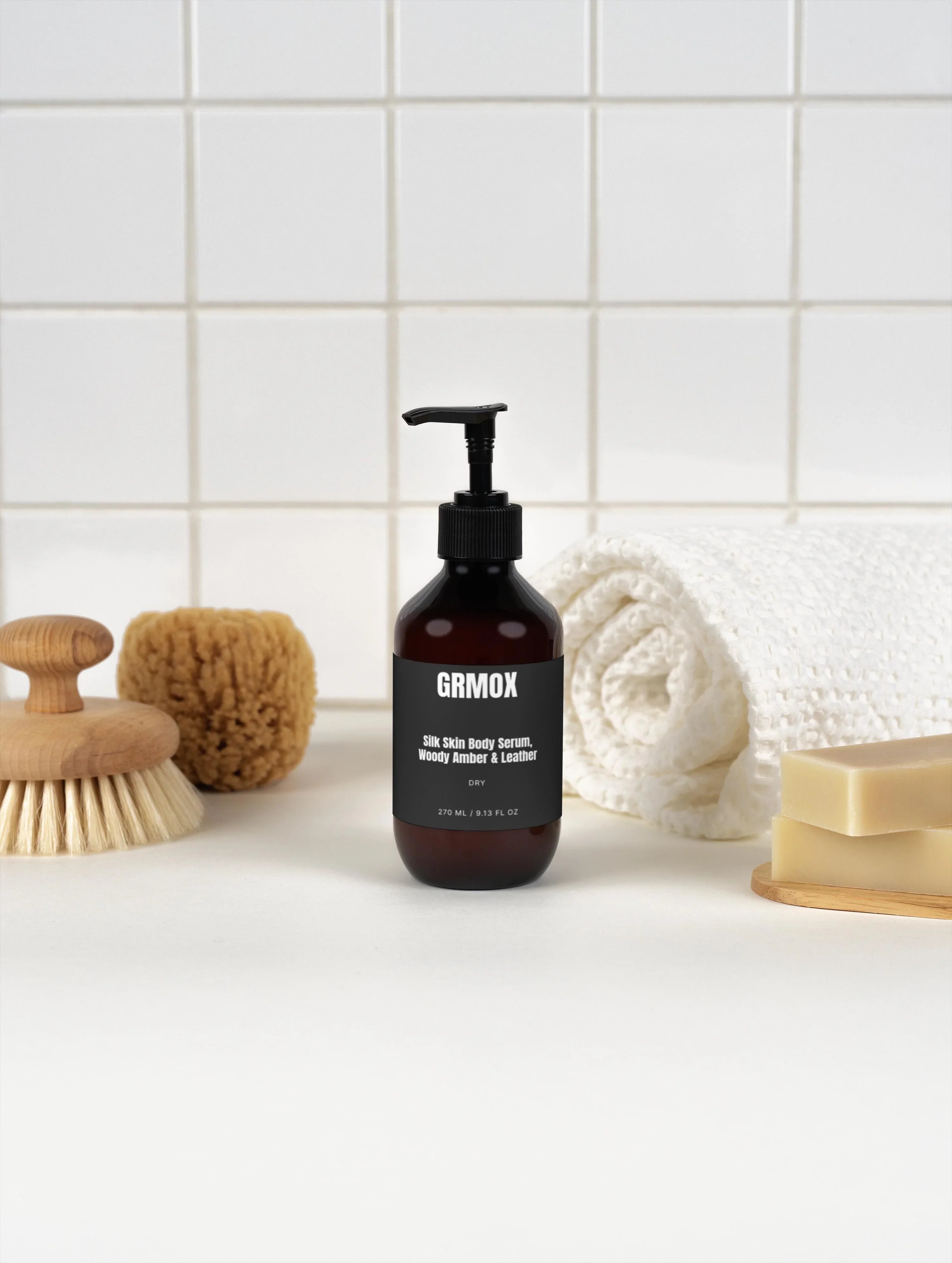 GRMOX Silk Skin Body Serum with Woody Amber & Leather scent, 270ml pump bottle in bathroom setting