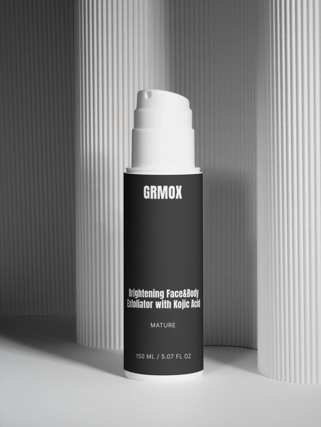 Brightening face and body exfoliator with kojic acid in sleek black bottle, 150ml