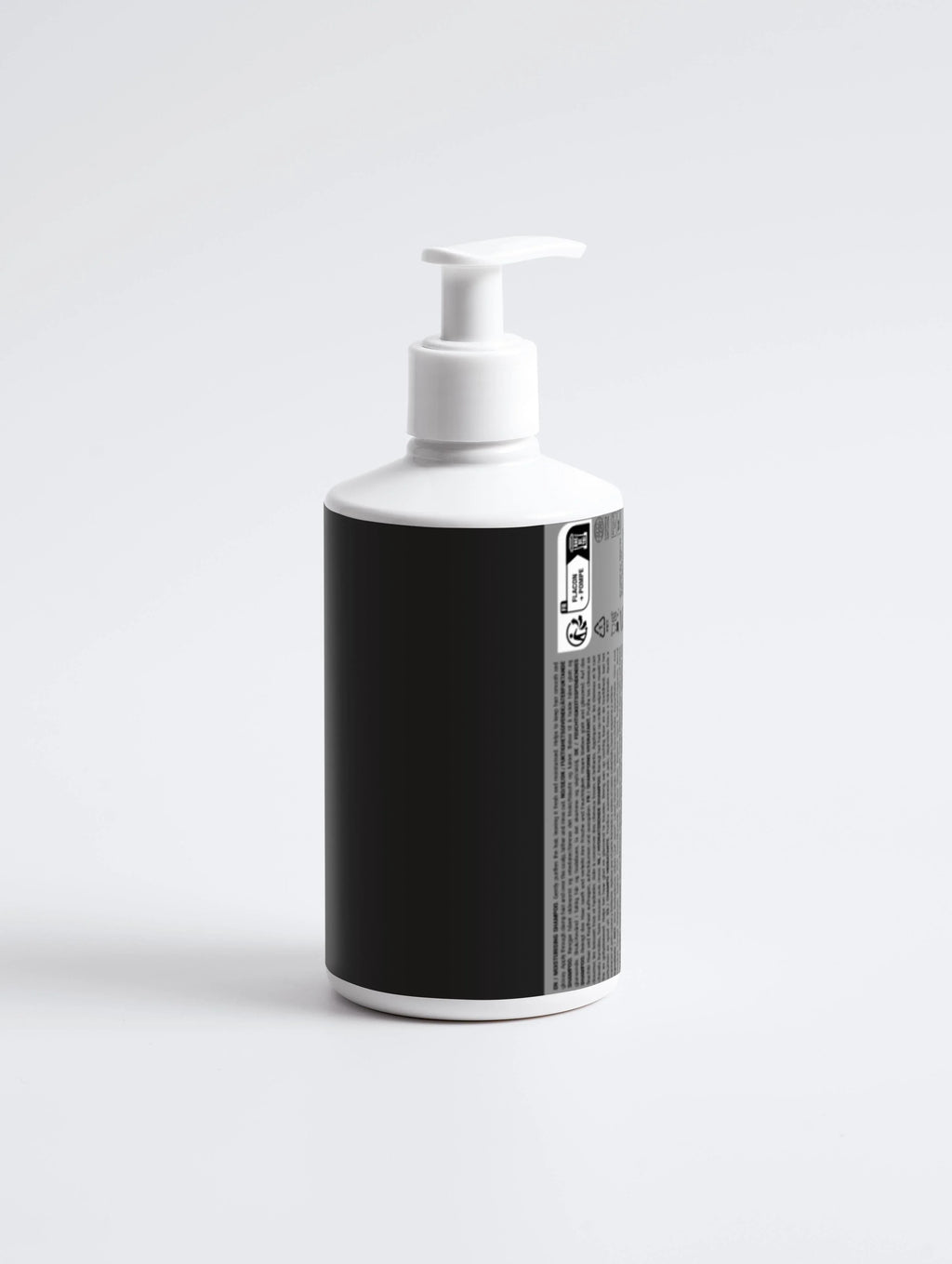 White pump bottle with black label, minimalist design for skincare or haircare product on white background