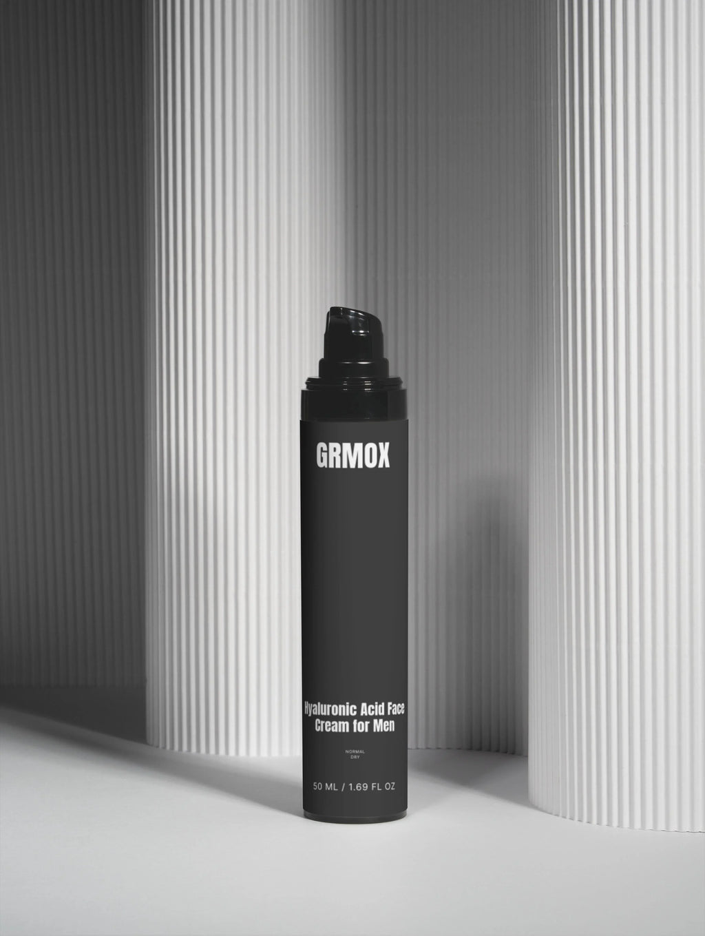 GRMOX Hyaluronic Acid Face Cream for Men, 50ml, black pump bottle against striped gray background
