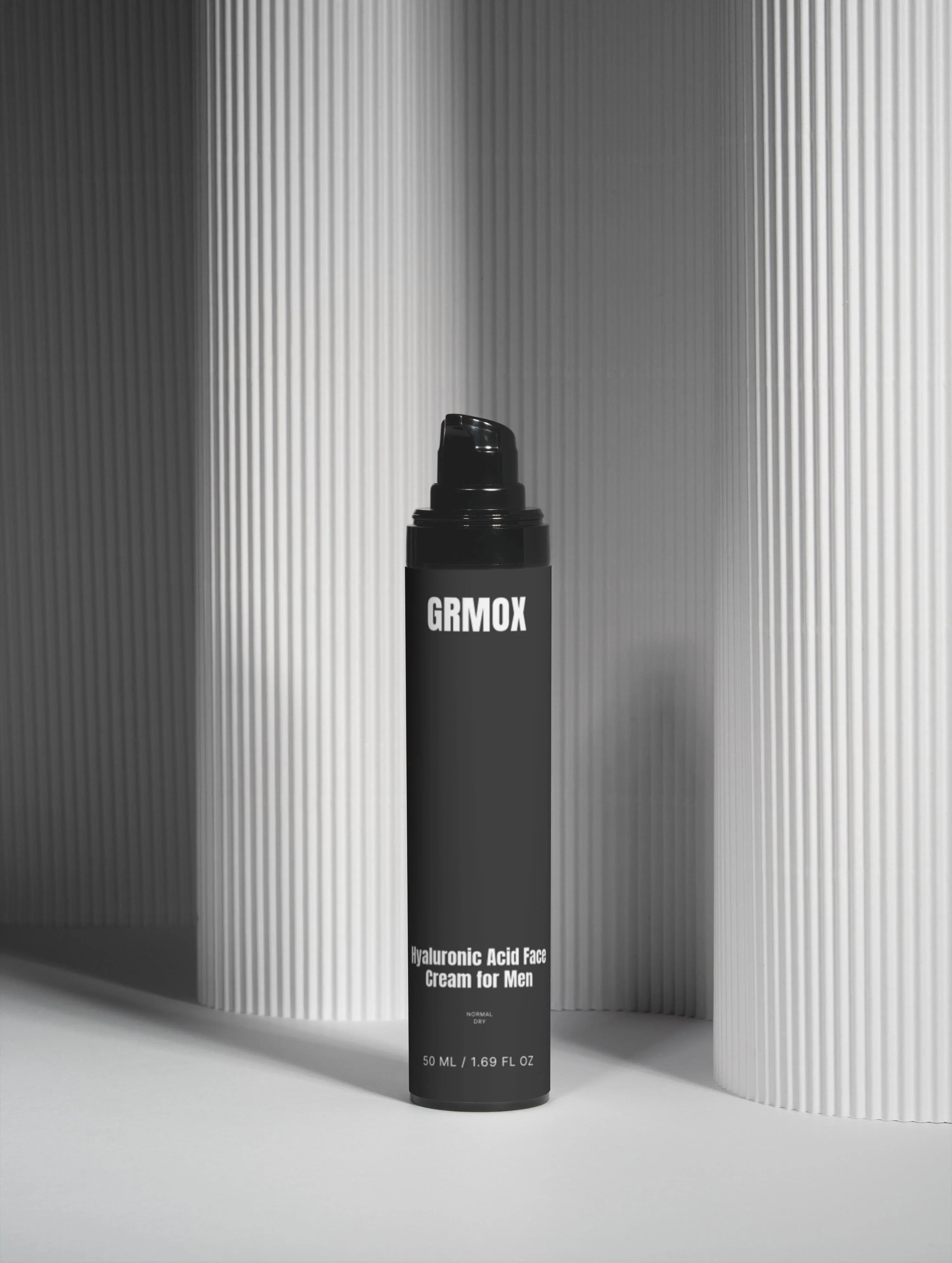 GRMOX Hyaluronic Acid Face Cream for Men, 50ml, black pump bottle against striped gray background