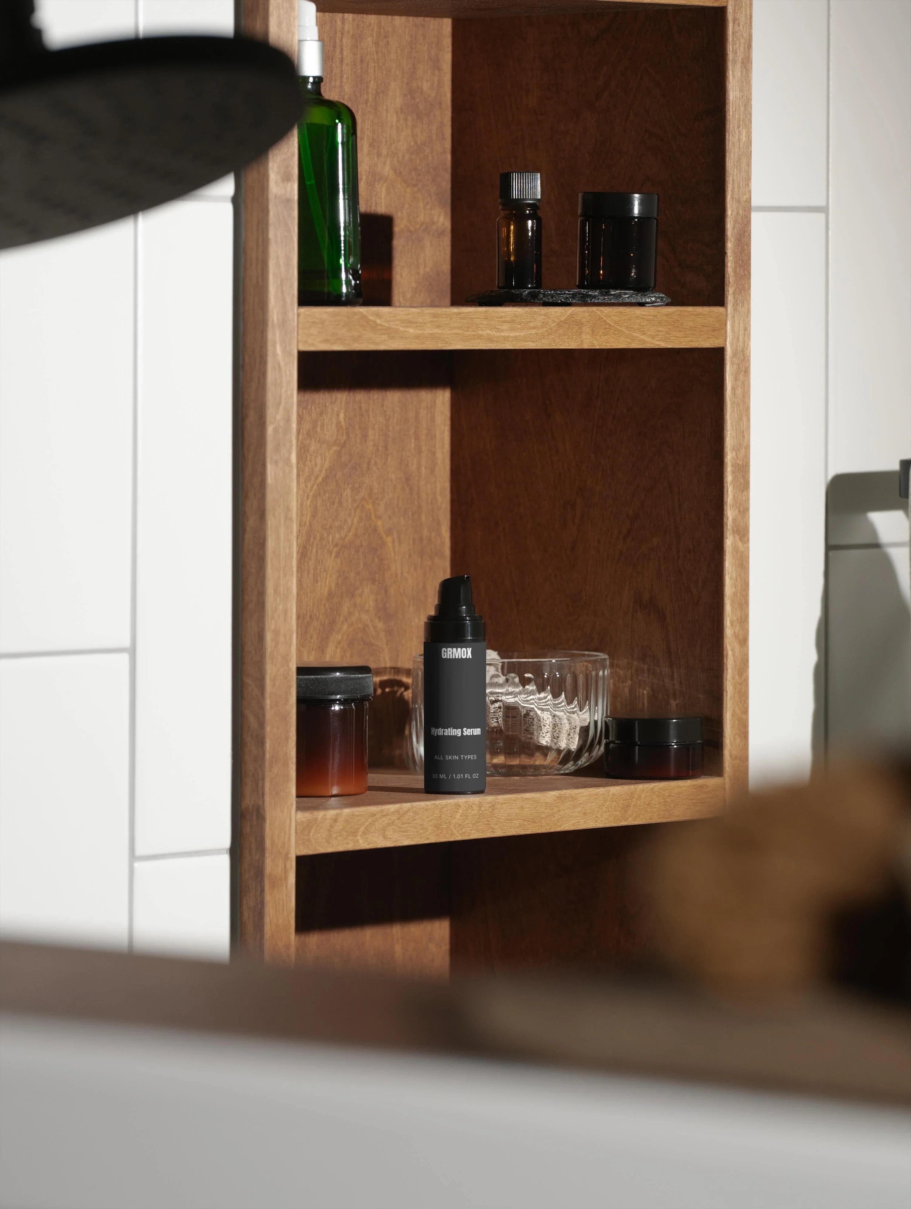 GRMOX Hydrating Serum for all skin types on wooden bathroom shelf with skincare products