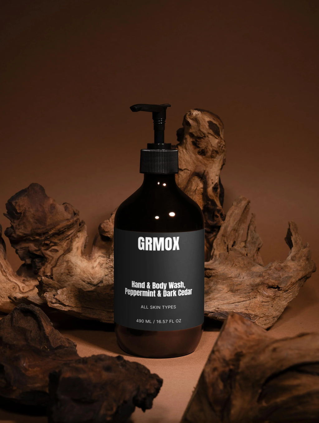 GRMOX Hand & Body Wash, Peppermint & Dark Cedar, 490ml bottle with pump, natural wood background