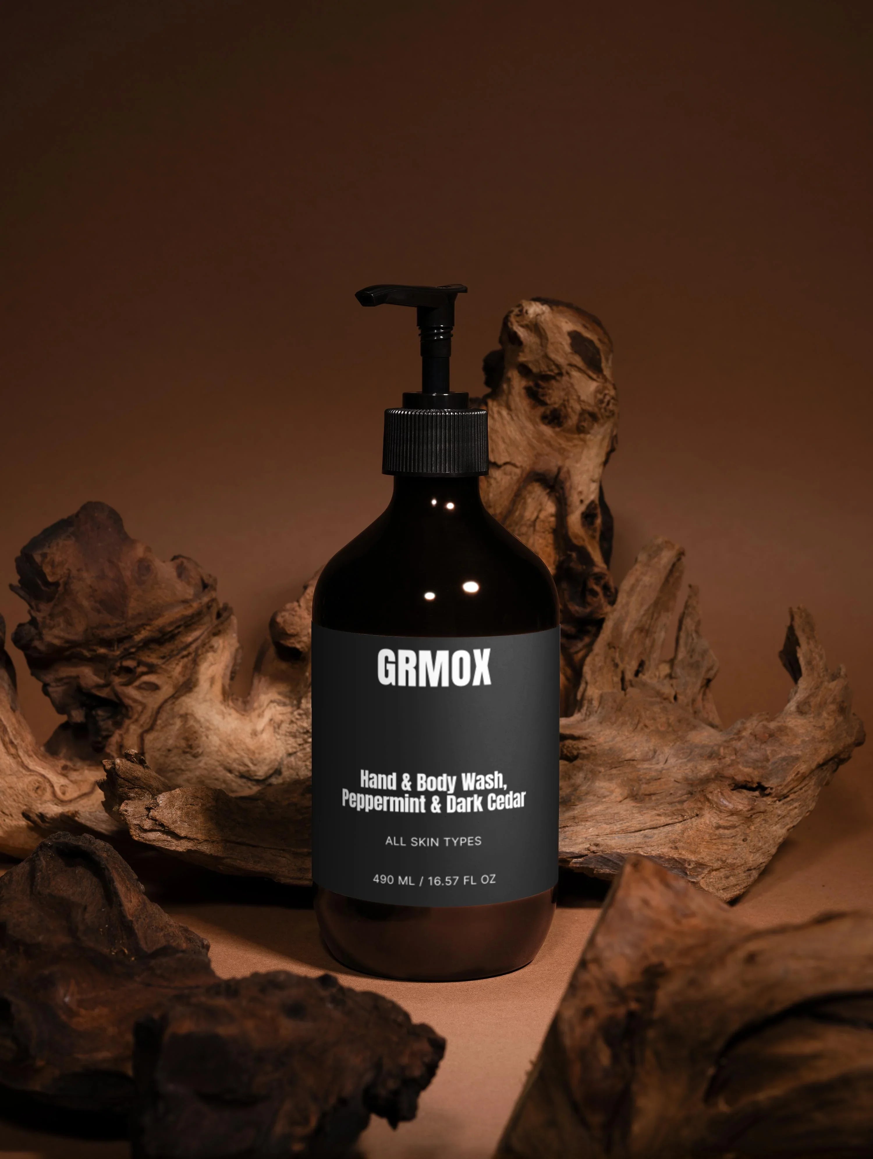 GRMOX Hand & Body Wash, Peppermint & Dark Cedar, 490ml bottle with pump, natural wood background