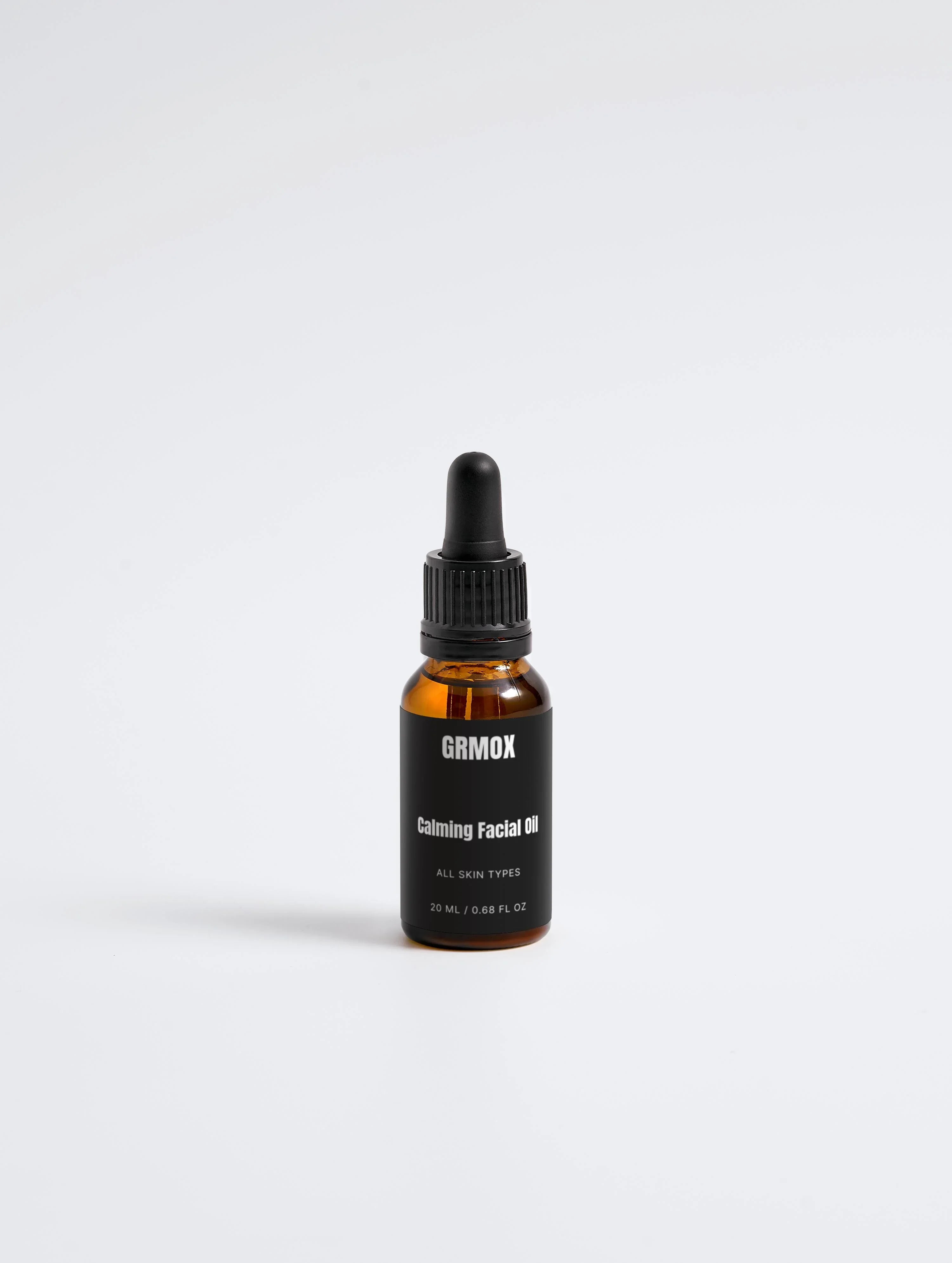 GRMOX Calming Facial Oil for all skin types, 20ml amber bottle with dropper, minimalist design