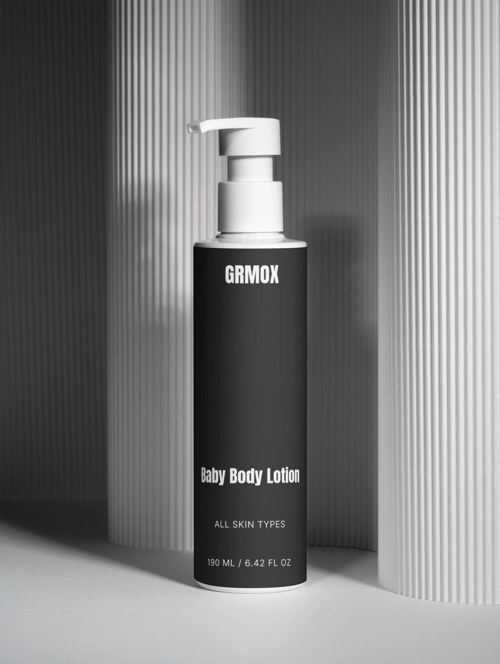 GRMOX Baby Body Lotion for all skin types, 190ml pump bottle against striped background