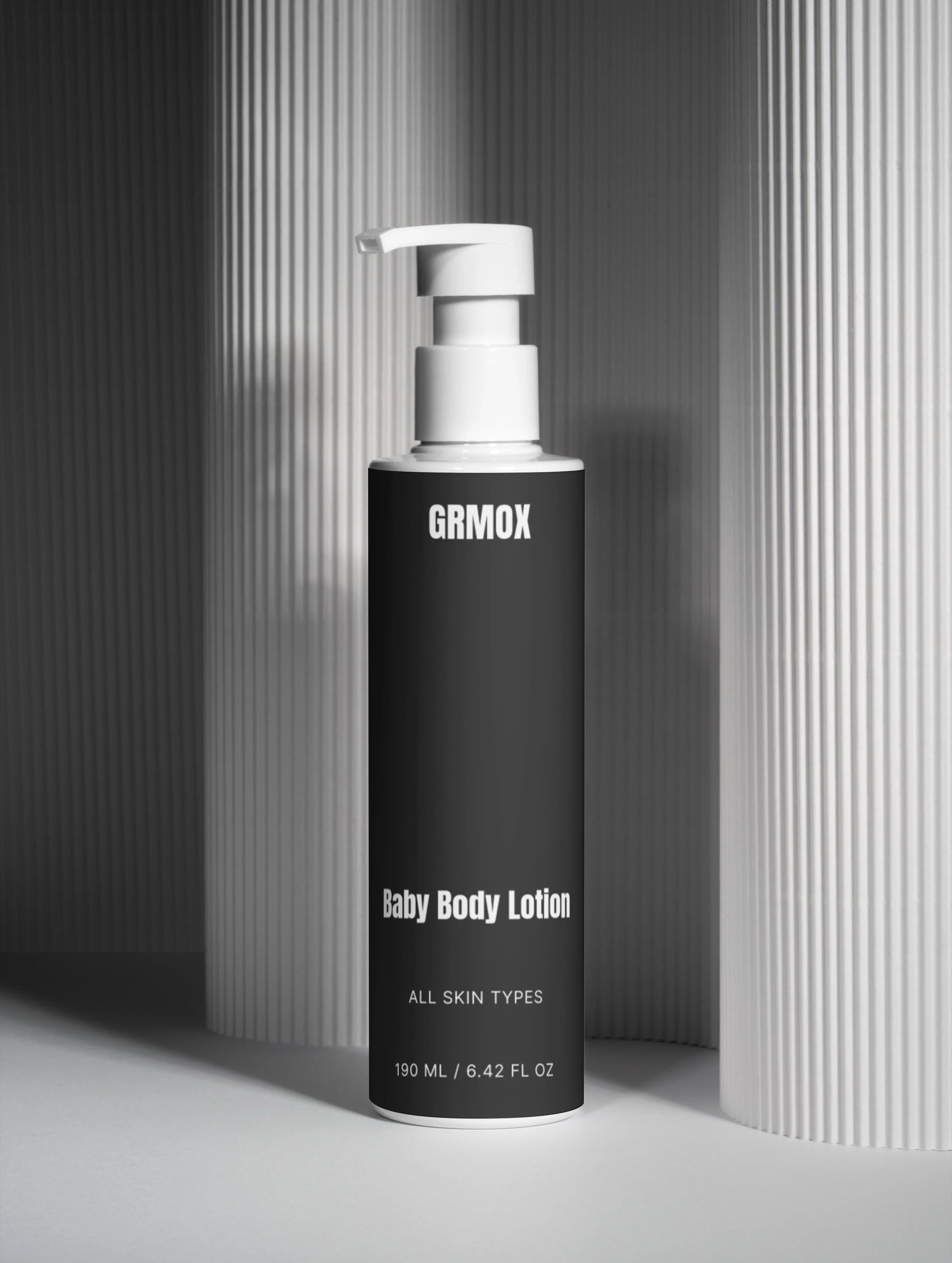 GRMOX Baby Body Lotion for all skin types, 190ml pump bottle against striped background