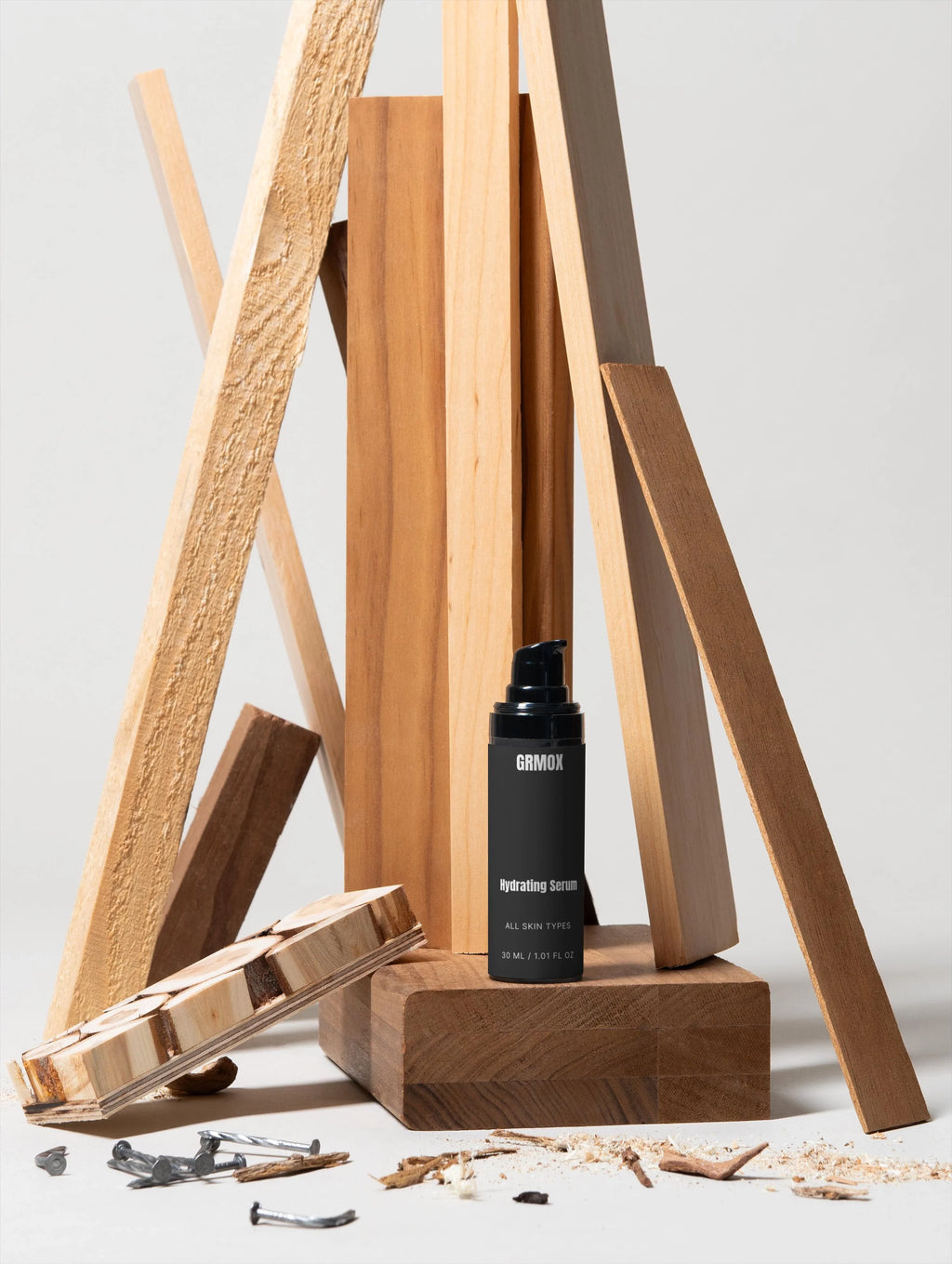 GRMOX Hydrating Serum for all skin types, 30ml, displayed with rustic wood planks and nails