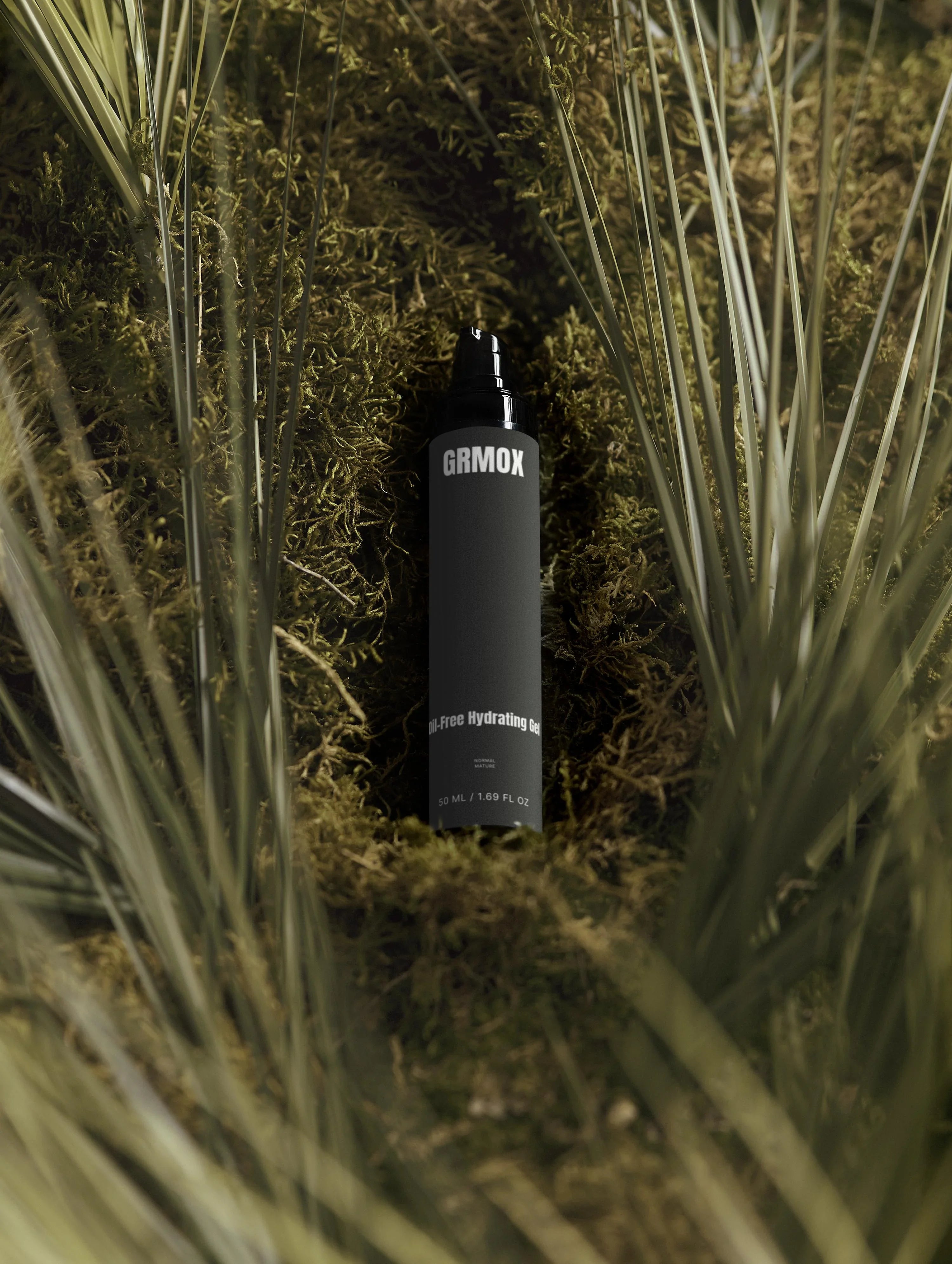 GRMOX Oil-Free Hydrating Gel 50ml nestled in moss and grass, natural skincare for normal to mature skin