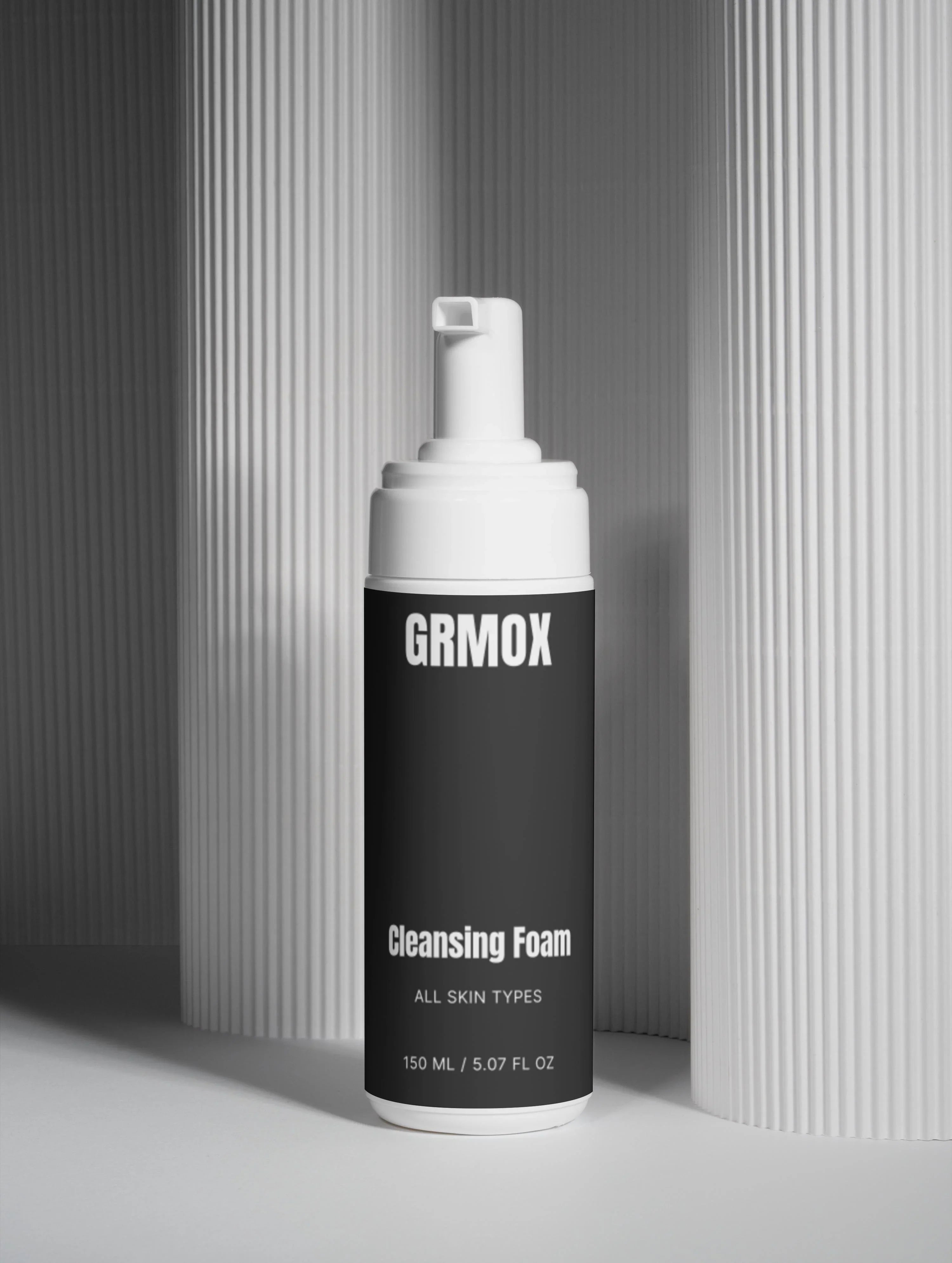 GRMOX Cleansing Foam for all skin types, 150ml bottle with pump dispenser on textured gray background