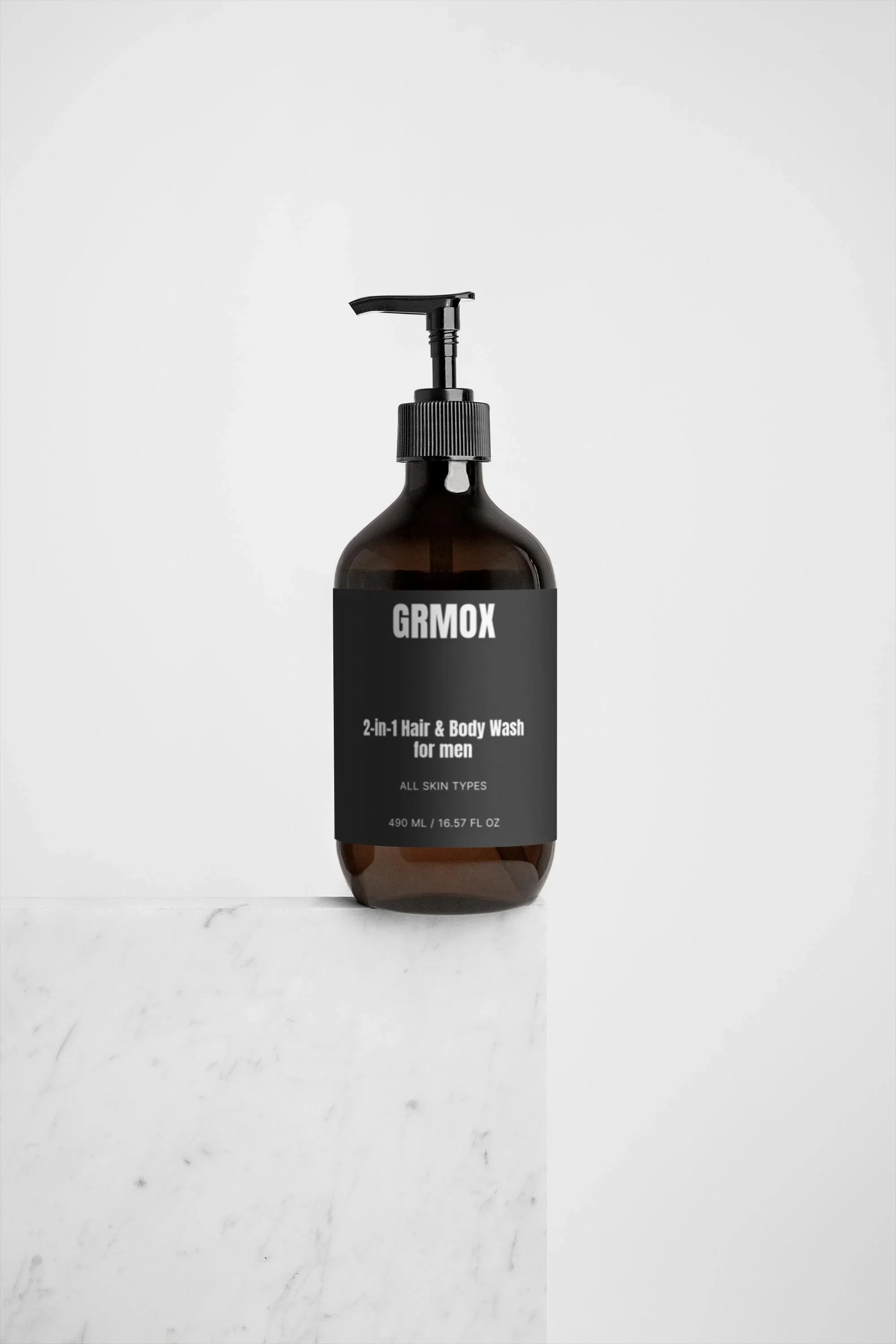 GRMOX 2-in-1 Hair & Body Wash for men, all skin types, 490ml, in amber bottle on marble