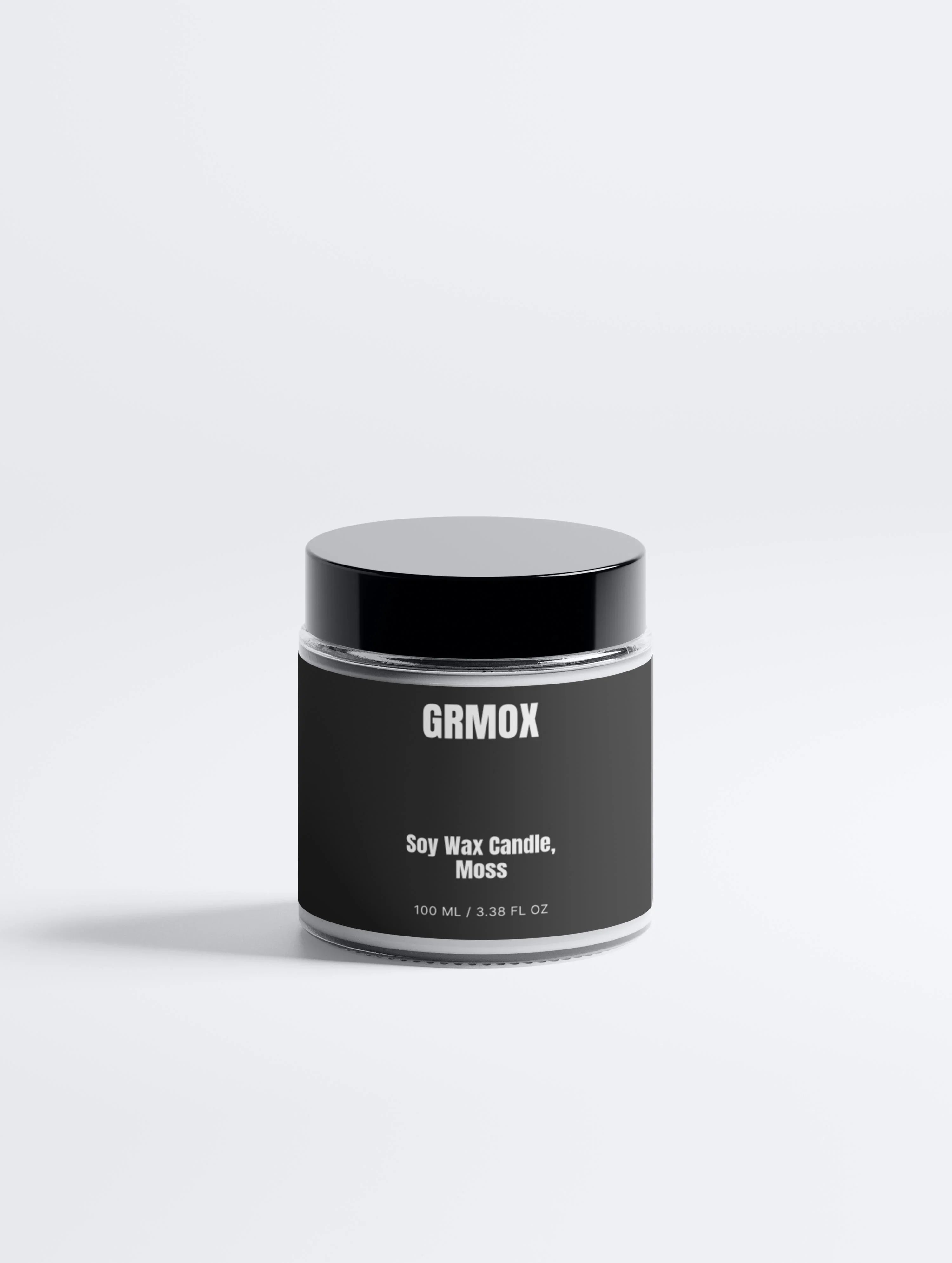 GRMOX soy wax candle in moss scent, 100ml glass jar with black lid, minimalist design
