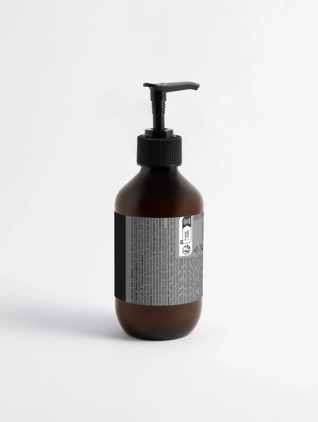 Dark amber pump bottle with black dispenser, labeled for hand cream or body lotion, minimalist design