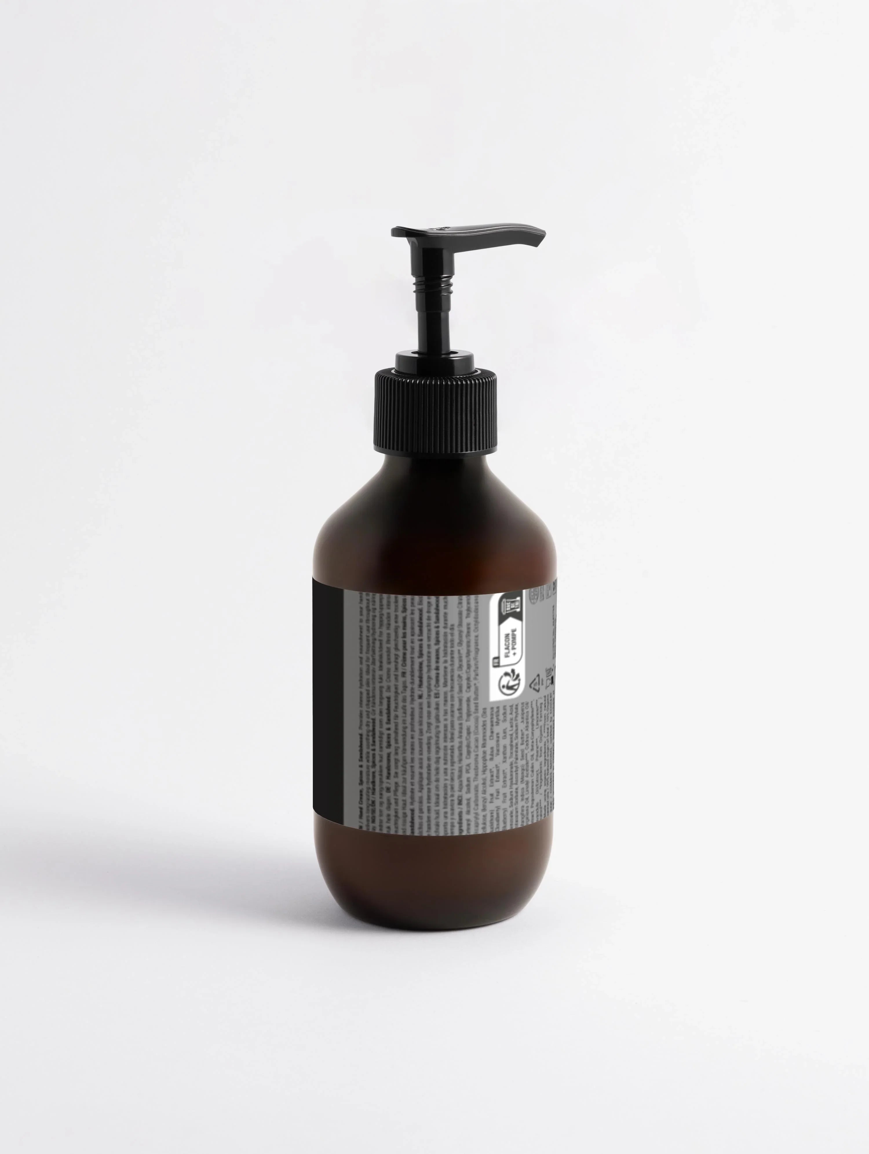 Dark amber pump bottle with black dispenser, labeled for hand cream or body lotion, minimalist design